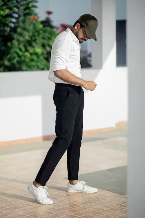Person walking in black straight-leg hemp-cotton trousers and white shirt